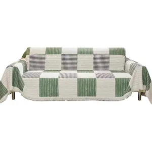 Green and white checkered anti-scratch sofa cover with tassels and houndstooth pattern