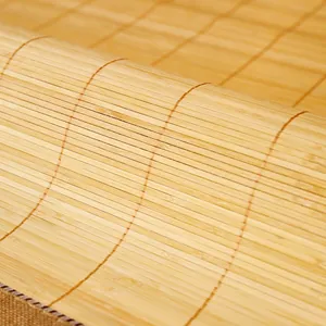 Modern woven bamboo sofa mat with flexible natural fiber slats and brown fabric piping
