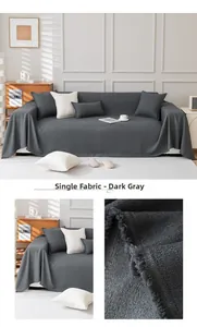 Macro detail of dark grey teddy fleece sofa cover with textured fabric and fringe edges