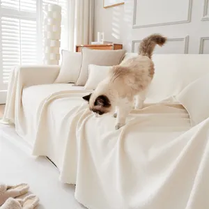 Waterproof teddy velvet sofa cover in cream white with fringe detail and cozy cat decor