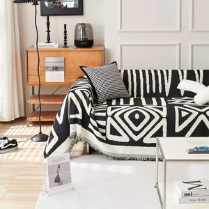 Chenille geometric sofa throw cover with black and white tribal patterns and fringe edge