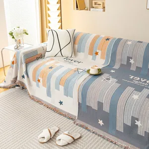 Copridivano in ciniglia con motivo a stelle e frange decorative in blu e beige