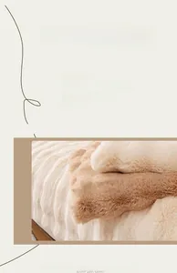 Detailed close-up of thick, soft faux rabbit fur fabric in warm white and light brown