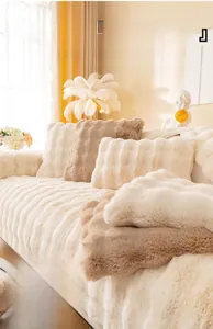 Detail of plush faux rabbit fur sofa cover with thickened quilted texture in cream white