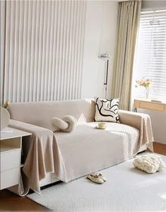 Close-up of thick chenille sofa cover showing detailed woven texture in beige