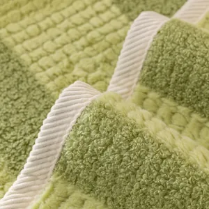 Thickened faux rabbit fur sofa cushion with green checkerboard pattern and non-slip texture