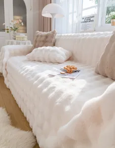 Detail of plush cream sofa cover featuring thick 3D striped velvet texture and soft feel