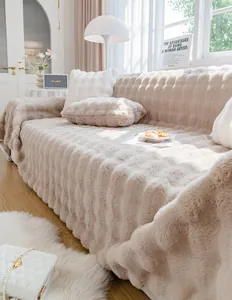 Detailed view of thick plush sofa cover with 3D striped texture in warm beige cream