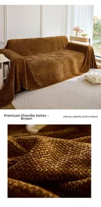 Macro detail of thick brown chenille sofa throw showing rich woven waffle texture