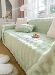 Detail of light green plush sofa cover with 3D wave texture and thick fuzzy material
