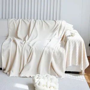 Thickened beige chenille sofa cover with waffle texture and fringed edges for home decor