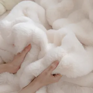 Thickened white plush sofa cover blanket featuring soft faux fur texture for winter warmth