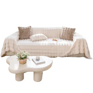 Thick plush sofa cover in cream white with soft striped texture and decorative pillows