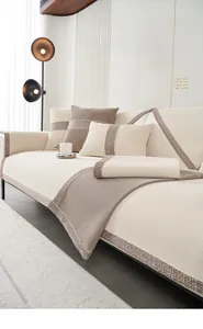 Detail of chenille sofa cushion featuring striped texture and woven decorative edges