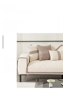 Detail of chenille sofa cushion with wavy quilted texture and decorative braided edges