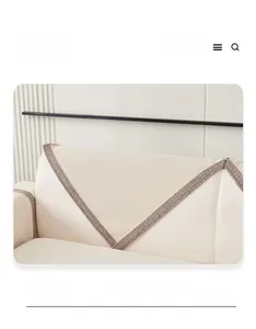 Detail of cream chenille sofa cover with double color stitching and woven texture
