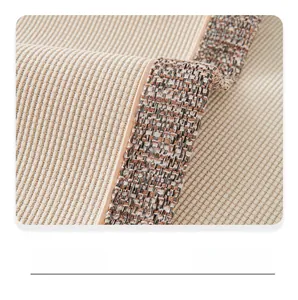 Detail of chenille sofa cover showing double color stitching and vertical striped texture