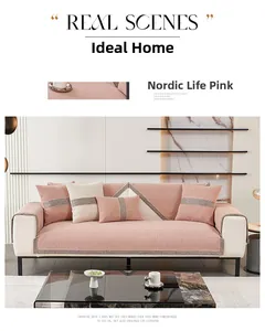 Detail of pink chenille sofa cover with Nordic lattice edging and textured weave fabric