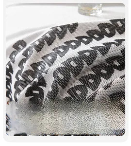 Detail shot of breathable ice silk sofa cover with black and white geometric pattern