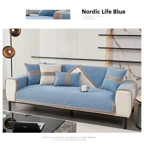 Close-up of blue chenille sofa cushion showing waffle texture and geometric woven edges