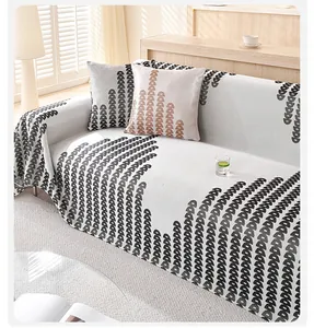 Macro detail of the ice silk cooling sofa cover with black and coffee geometric patterns