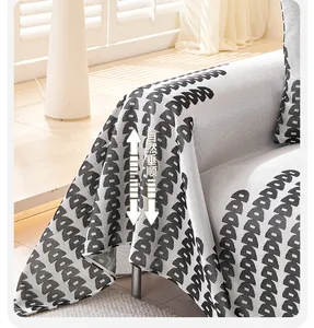Detail shot of ice silk sofa cover fabric featuring a jacquard pattern and natural drape