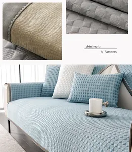 Macro detail of breathable quilted sofa mat showing anti-slip silicone dots and blue fabric