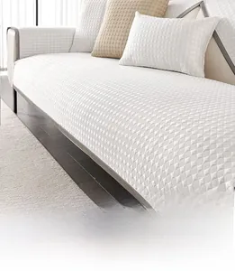 Detail of white antibacterial fiber sofa mat with textured round quilting for summer