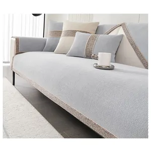 Detail of light blue chenille sofa cushion with textured grey borders and waffle weave fabric