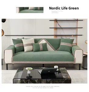 Detail of green chenille sofa cover with non-slip texture and woven edge piping