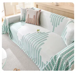 Close-up of cooling ice silk sofa cover with green leaf pattern and knit texture