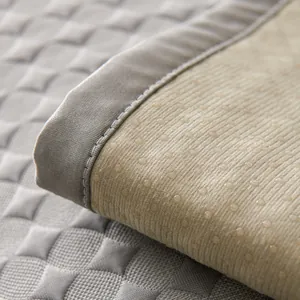 Cooling summer sofa mat with breathable gray quilted texture and anti-slip backing