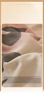 Close-up of thick chenille fabric texture showing soft pink and cream fibers on a sofa cover