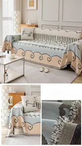 Detail of chenille jacquard sofa cover with bohemian patterns and decorative tassels