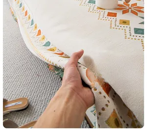 Close-up of Bohemian chenille sofa cover showing woven texture and fringe details