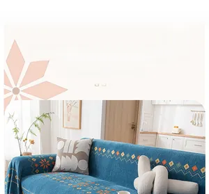 Detail of bohemian chenille sofa cover with orange geometric patterns and blue knit texture