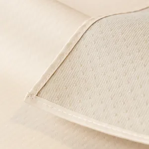 Waterproof faux sheepskin sofa cushion with non-slip backing and champagne grid texture