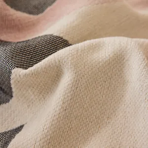 Reversible chenille sofa cover with striped woven texture and premium fabric details