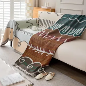 Nordic woven sofa cover blanket with geometric patterns and fringe for modern living rooms
