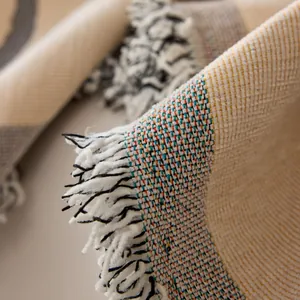Nordic woven sofa cover with colorful texture and decorative fringe tassels