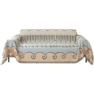 Modern Nordic jacquard sofa cover with fringe, geometric wave pattern in beige and blue