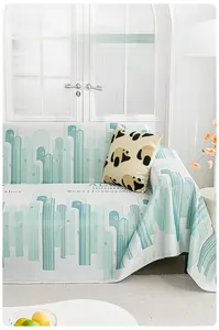 Close-up of cooling ice silk sofa cover with mint green geometric stripe patterns