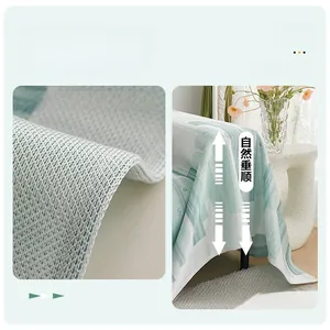 Detail of high-density stitching and light green geometric pattern on ice silk sofa cover