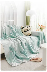 Detail of ice silk sofa cover featuring green cactus print and cooling fabric texture