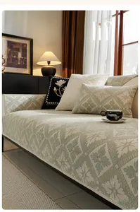 Detailed close-up of light green chenille sofa cover with 3D geometric jacquard pattern