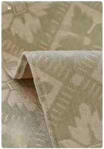 Close-up of green corn kernel chenille sofa mat with geometric patterns and wide borders