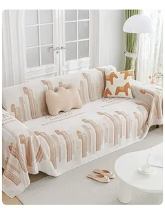 Close-up of beige ice silk sofa cover with geometric stripes and printed letters