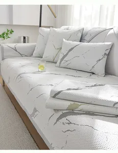 Close-up of honeycomb textured cooling ice silk sofa mat with marble pattern and pillow