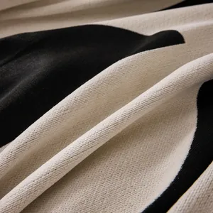 Abstract black and white woven sofa cover blanket with luxury knit texture and fringe
