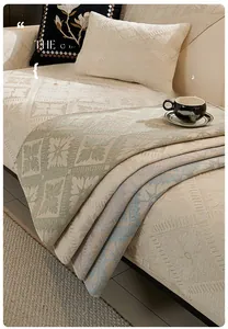 Close-up of chenille sofa cushion showing textured corn kernel weave and soft fabric detail